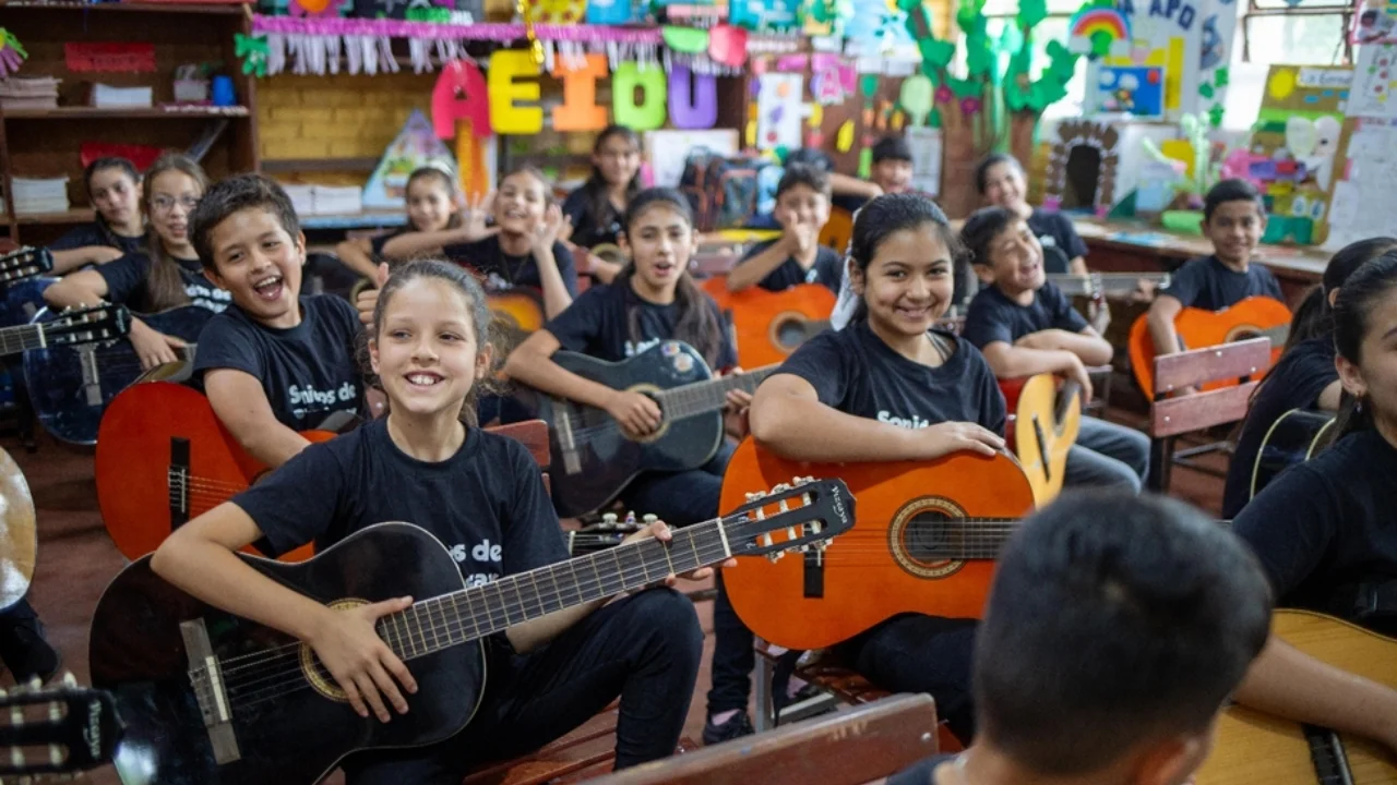 Photo: Children from Sounds of the Earth playing their guitars during rehearsal